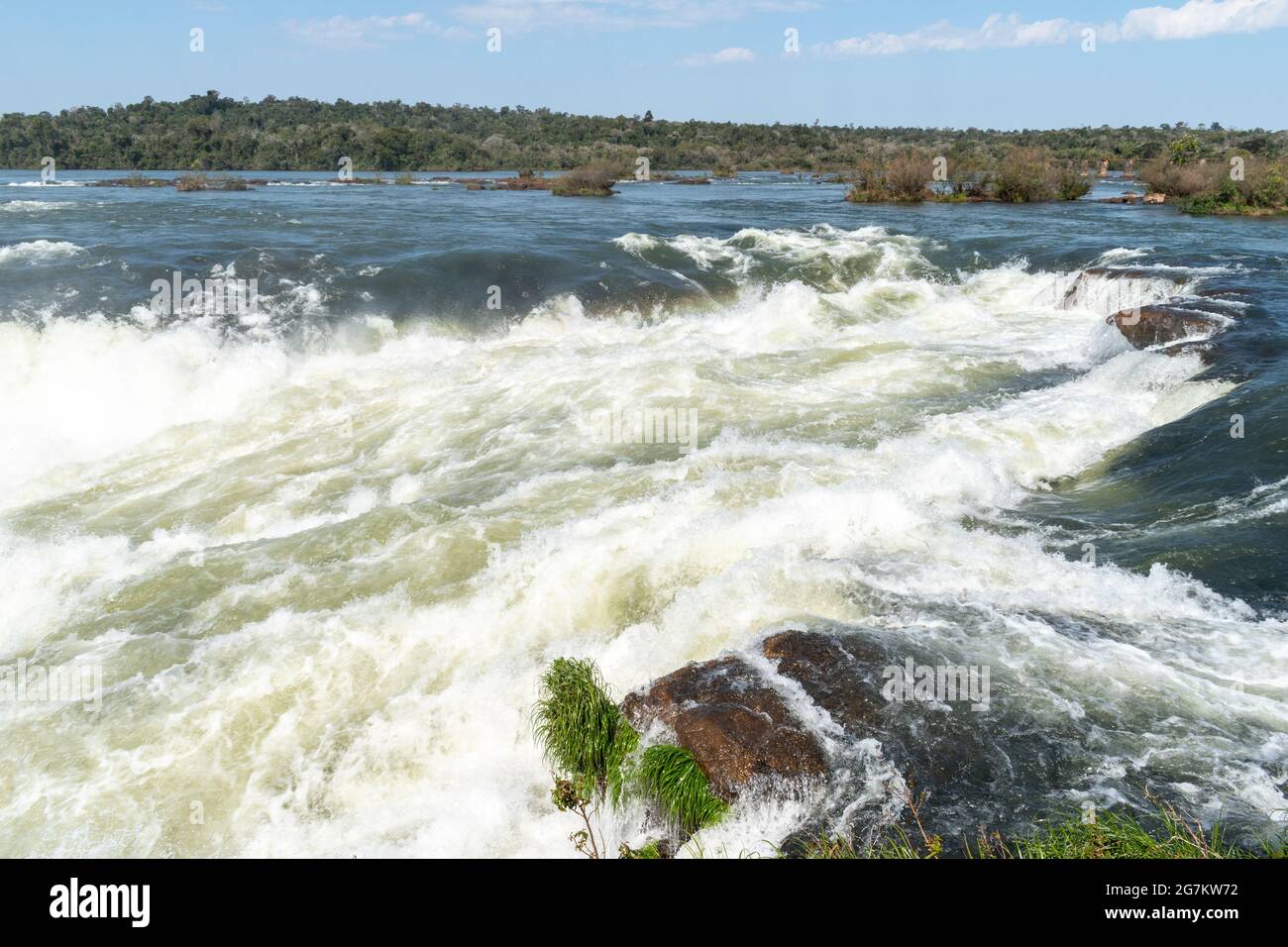 Water tumbles over the edge of Iguazu Falls, Argentina Stock Photo
