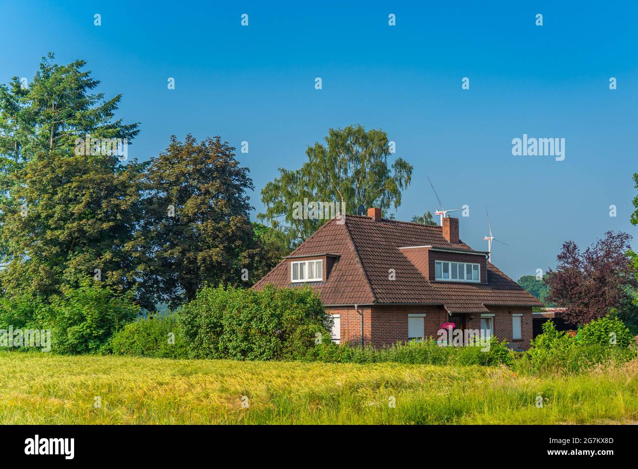 SANDKRUG, GERMANY JUNE 18.2021: Country house in Sandkrug, example of builing in a village in the Oldenburg country, Lower Saxony, Germany Stock Photo