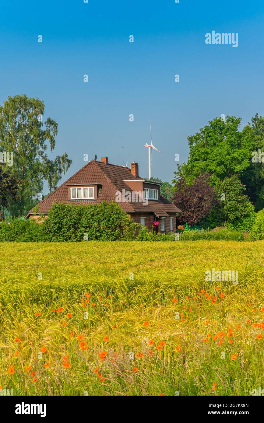 SANDKRUG, GERMANY JUNE 18.2021: Country house in Sandkrug, example of builing in a village in the Oldenburg country, Lower Saxony, Germany Stock Photo