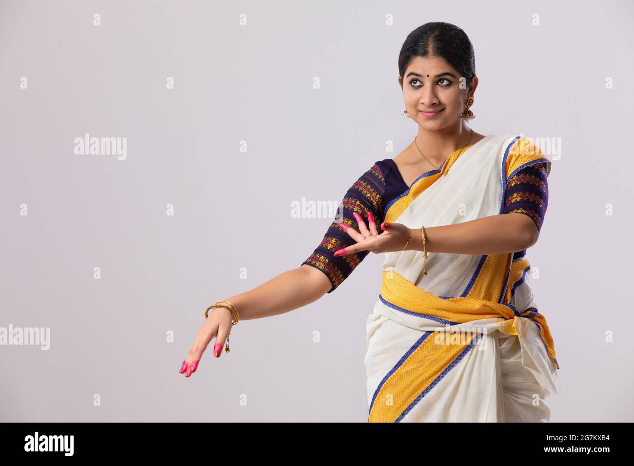 Woman in a South Indian saree practicing (No Suggestions) mudra Stock Photo