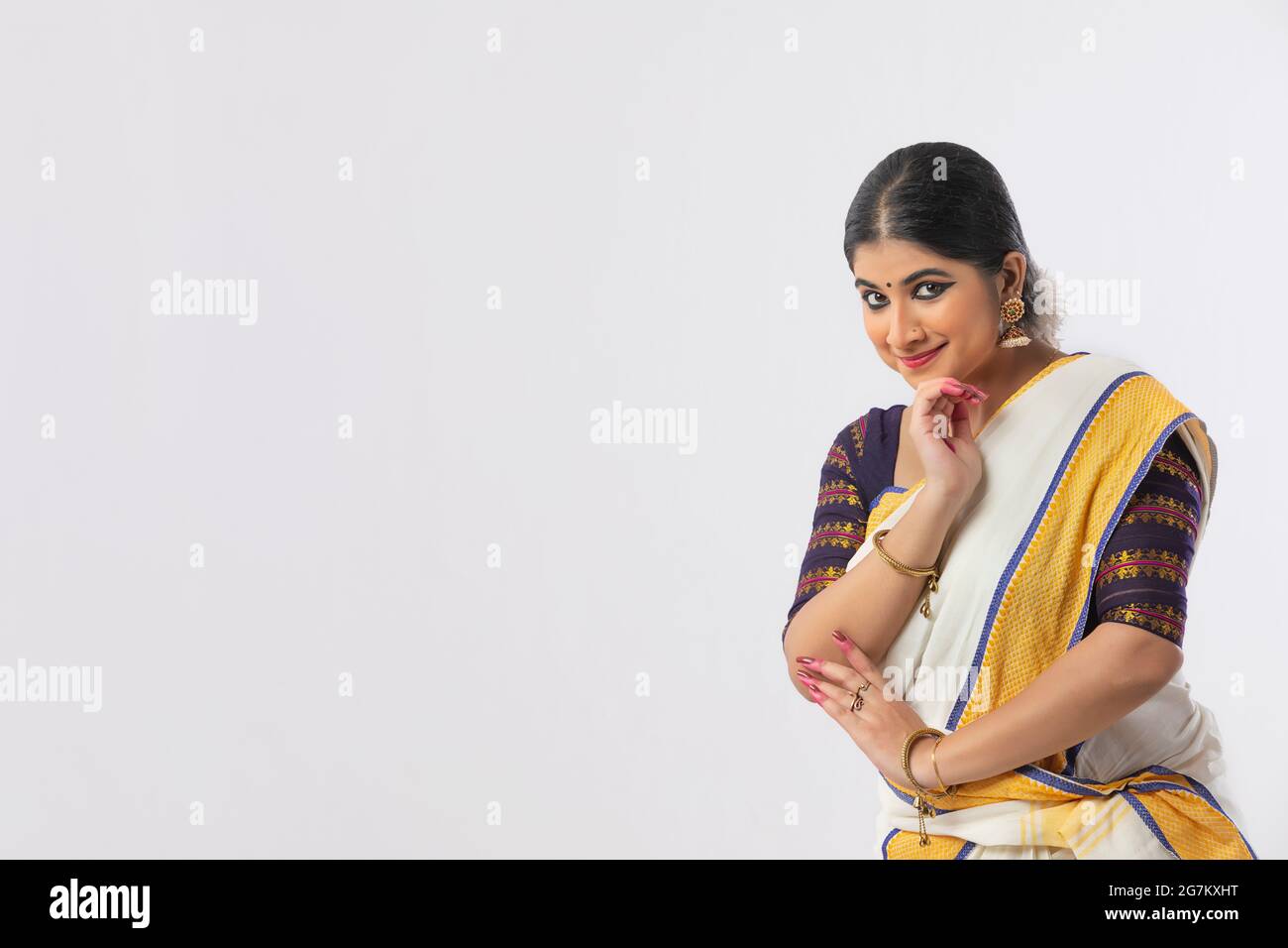 Classical dancer smiling with her hand supporting her chin Stock Photo