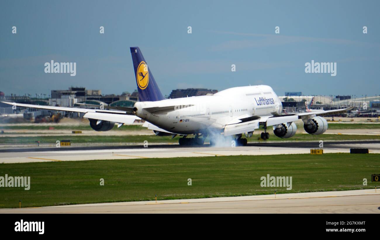 CHICAGO, UNITED STATES - Jul 03, 2021: Lufthansa Boeing 747 touches down on the runway at Chicago O'Hare International Airport on a busy summer travel Stock Photo