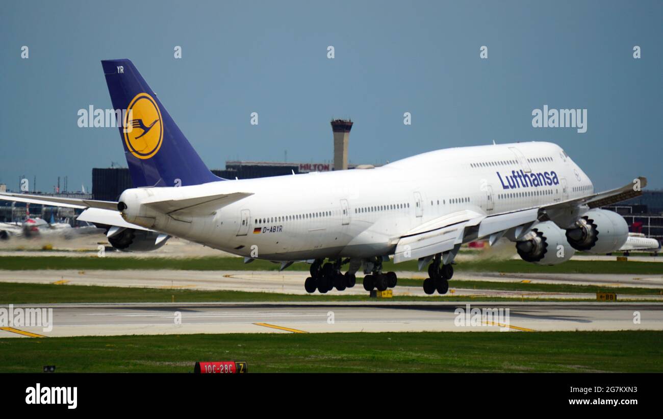 CHICAGO, UNITED STATES - Jul 02, 2021: A Lufthansa Boeing 747 Airplane touches down on the runway, arriving at Chicago O'Hare International Airport on Stock Photo