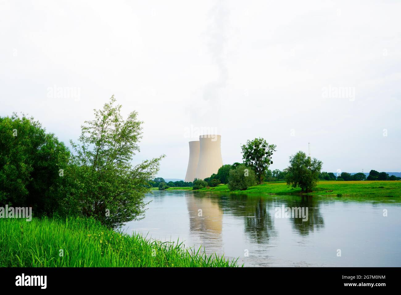 Nuclear power plant in Grohnde with cooling towers and surrounding landscape. Stock Photo