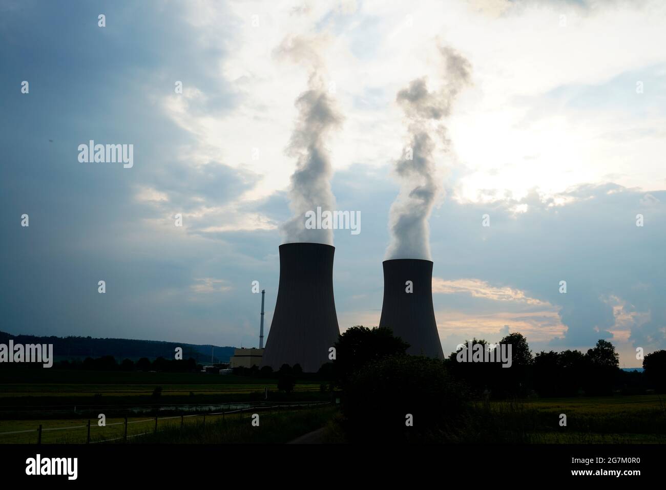 Nuclear power plant in Grohnde with cooling towers as a silhouette in the evening. Stock Photo