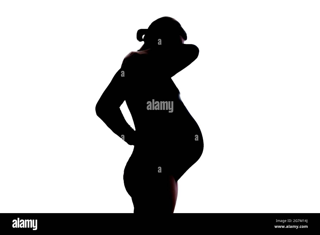 Pregnant woman standing with a pain in the neck Stock Photo