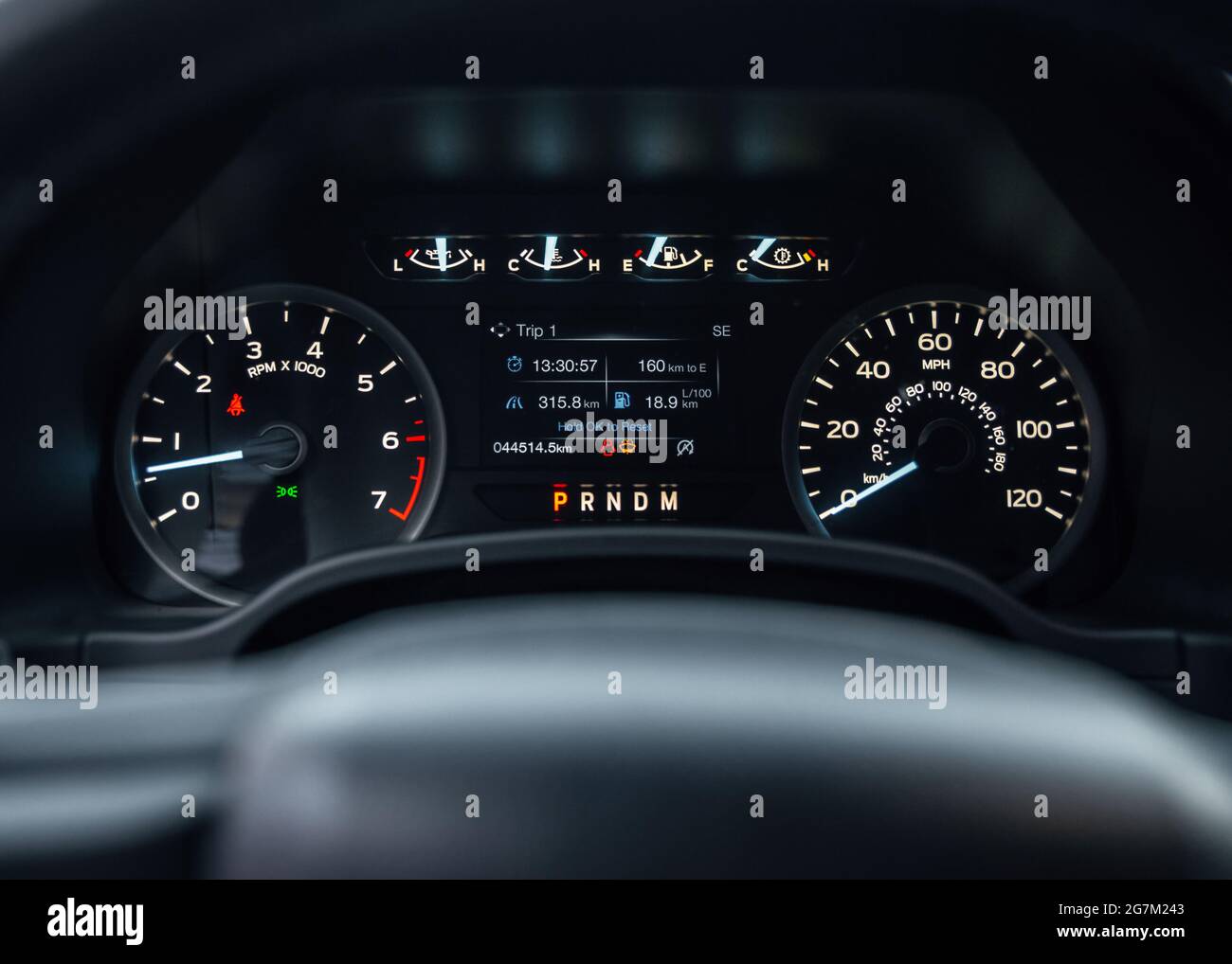 Speedometer of a new modern car with an integrated fuel gauge in the