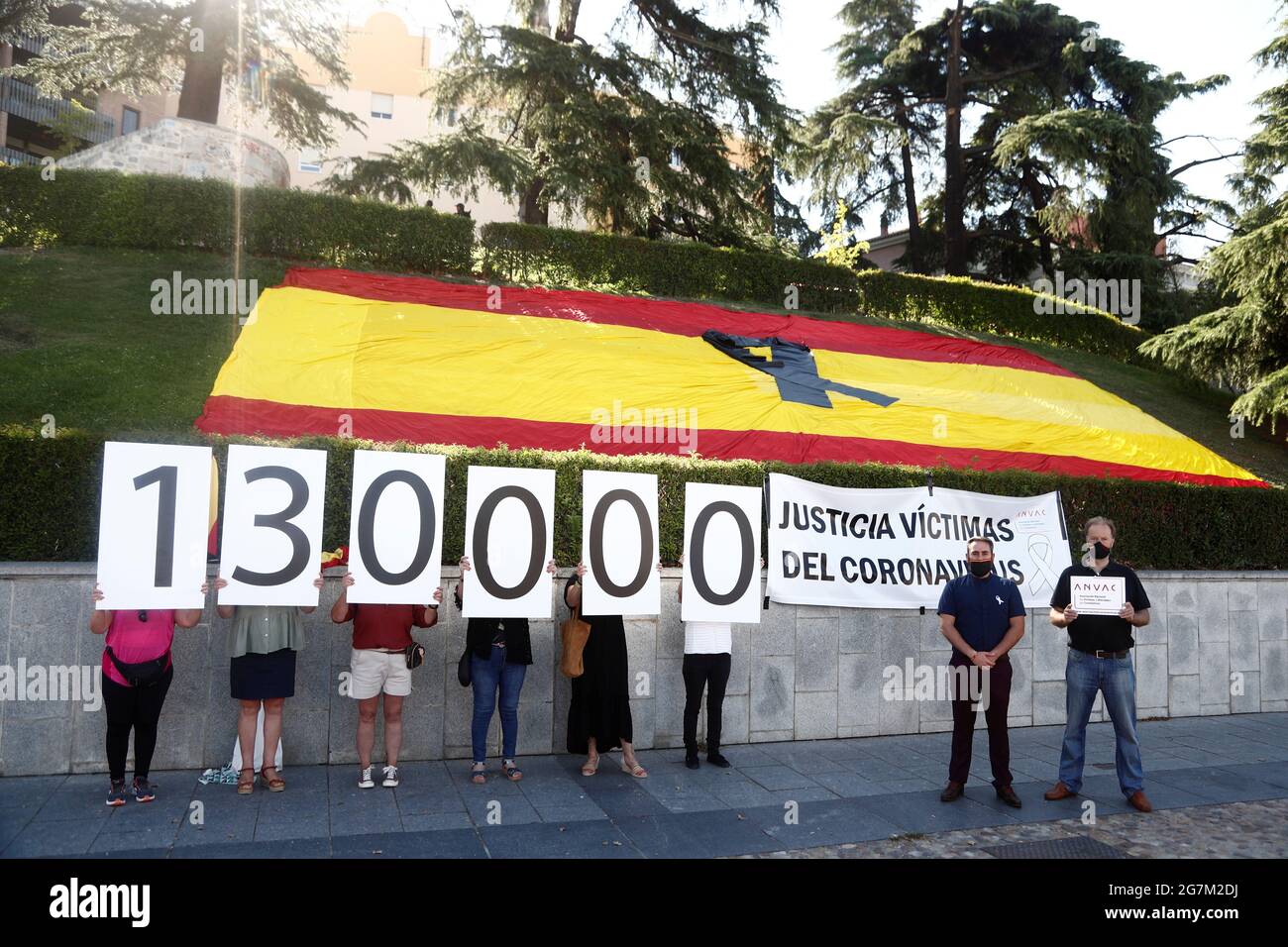 Family members of COVID victims hold up number signs during a state tribute in memory of Spain's coronavirus disease (COVID-19) victims, at the Royal Palace in Madrid, Spain, July 15, 2021. REUTERS/Javier Barbancho Stock Photo