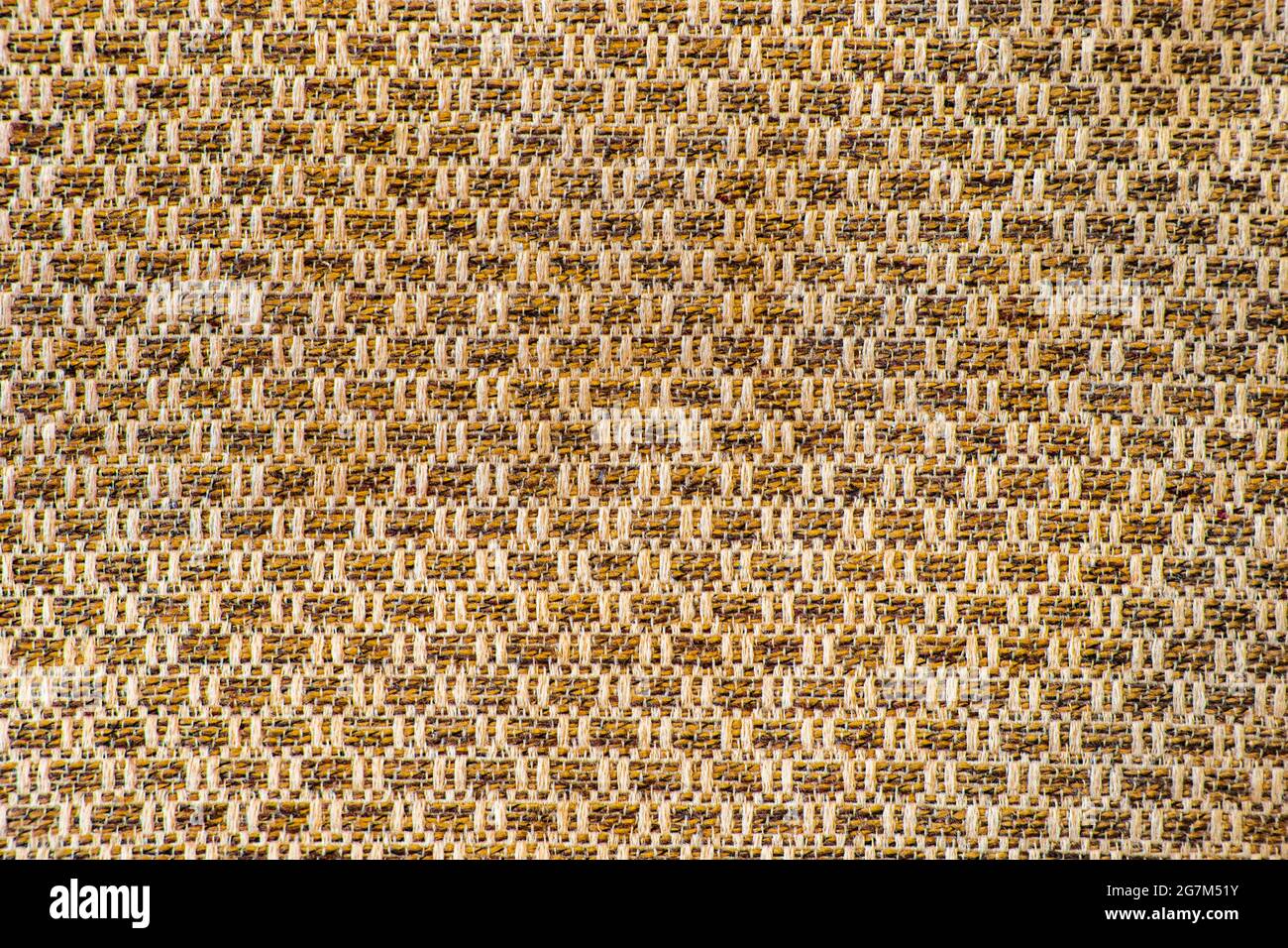 Image of a fabric rough brown background with repeating patterns Stock Photo