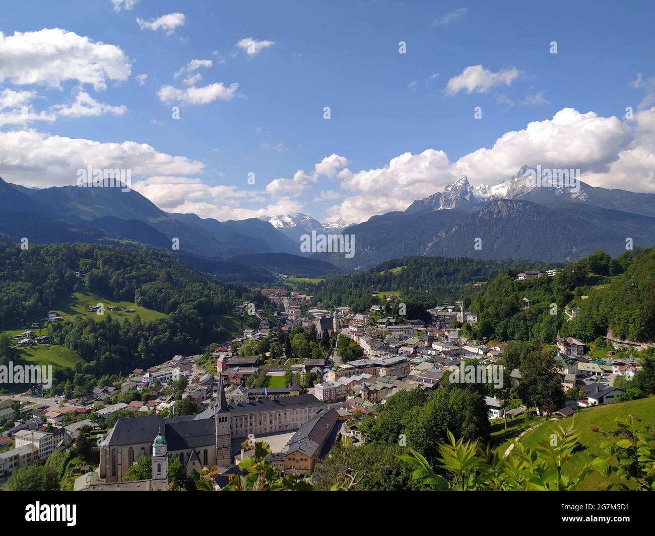 Aerial shot of  village houses in the middle of beautiful mountains in Berchtesgarden, Germany Stock Photo