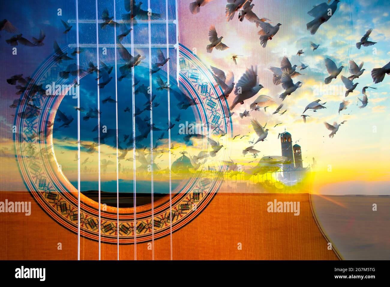 Acoustic guitar composition. Double exposure sunset landscape and doves