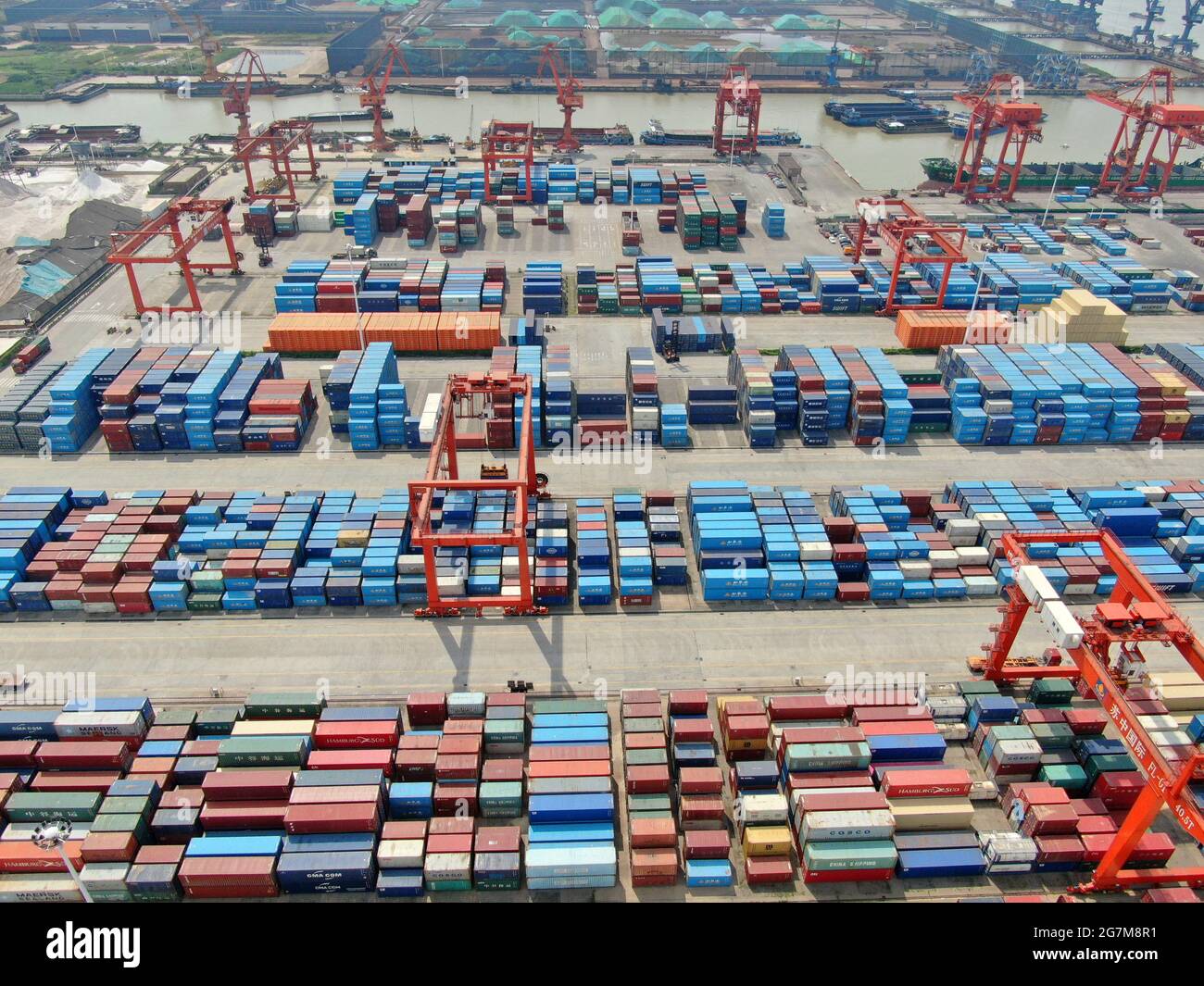 Nantong, Nantong, China. 15th July, 2021. The busy container terminal of  Suzhong International in Rugao Port taken on July 15, 2021. According to  the information provided by the Transportation Bureau of Nantong