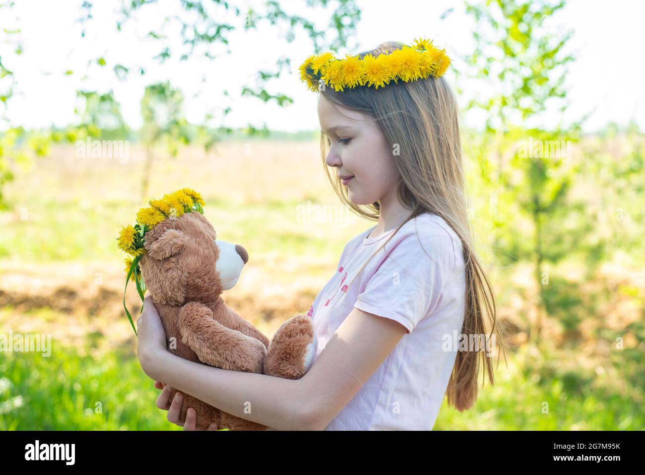 Child with teddy bear hi-res stock photography and images - Alamy