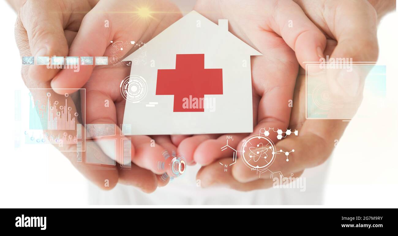Digital interface with data processing against medical cross symbol on house placard on cupped hands Stock Photo
