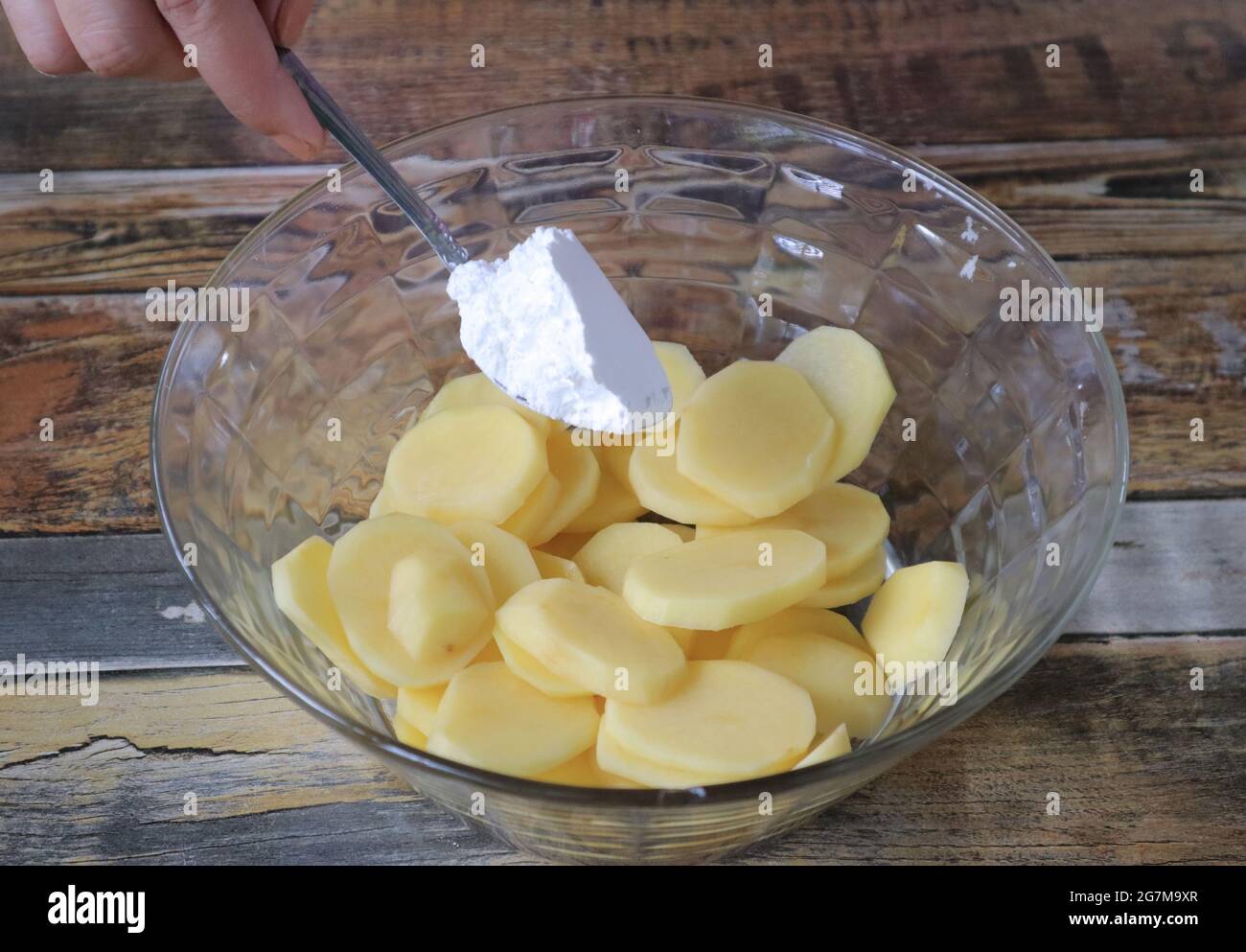 corn starch adding on potatoes Stock Photo Alamy