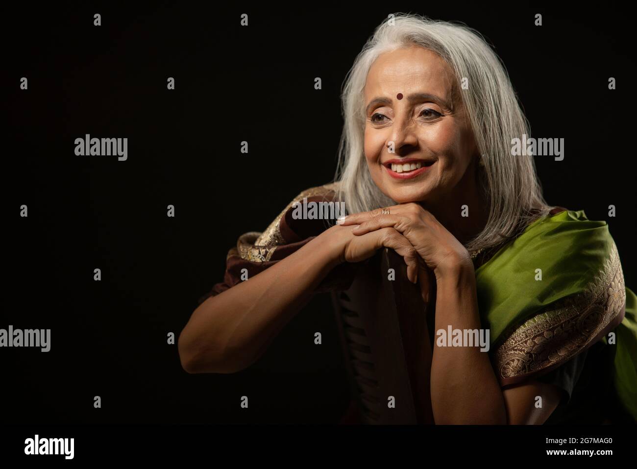Portrait of old beautiful woman well dressed in a saree. Stock Photo
