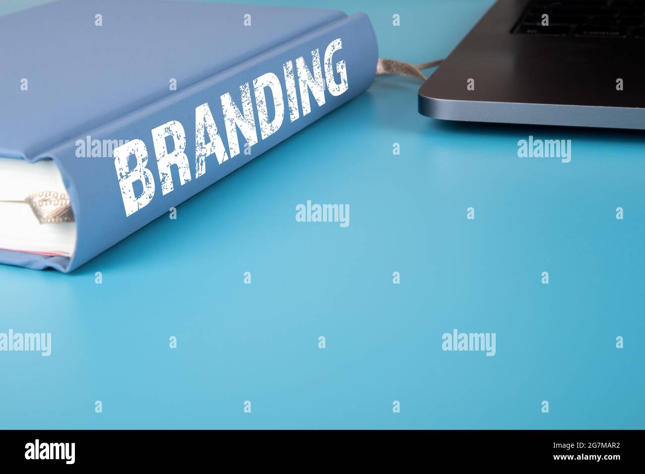 Brander Notebook Branding. Notebook and laptop on the office desk Stock Photo - Alamy