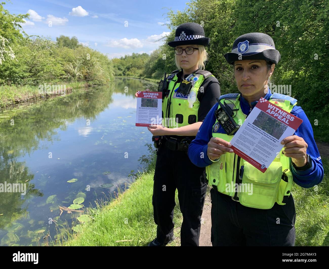 File photo dated 27/5/2021 of PC Charlotte Gardner and PCSO Suki Lally in rough Wood country park in Walsall, who have been among officers leafleting the local area to raise awareness about the incident where a dead newborn baby boy was found in the local canal. A £5,000 reward is being offered for information about the suspected murder of a newborn baby whose body was found in the West Midlands canal. Issue date: Thursday July 15, 2021. Stock Photo