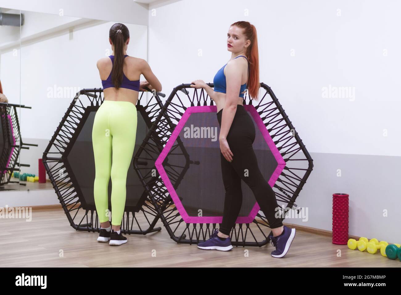 two sports girls are engaged in jumping on a sports trampoline Stock ...