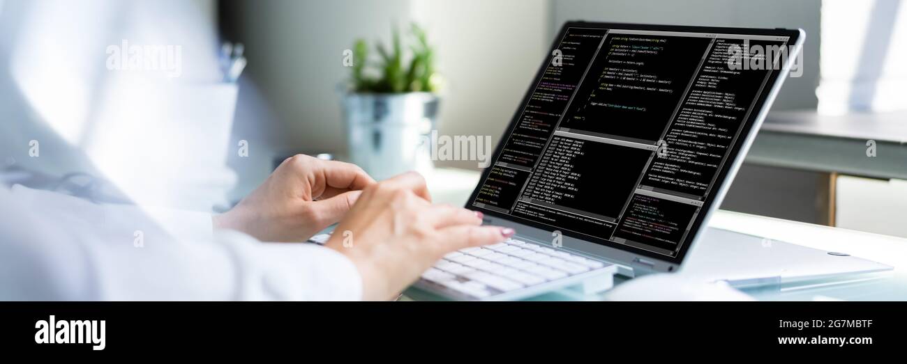 Programmer Woman Coding. Girl Coder And Web Developer Stock Photo