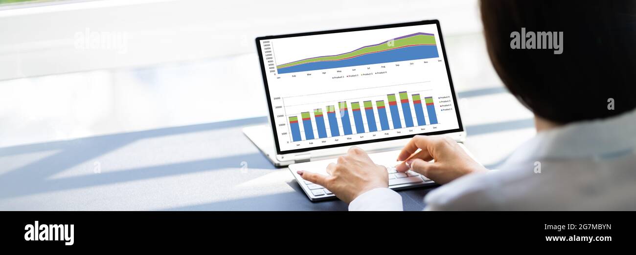 Analyzing Data Graph And Dashboard On Laptop Stock Photo