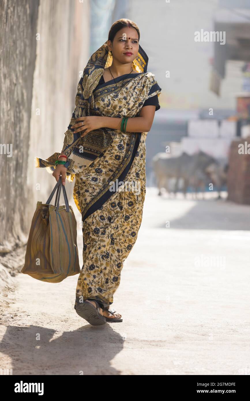Indian woman walking village hi-res stock photography and images - Alamy