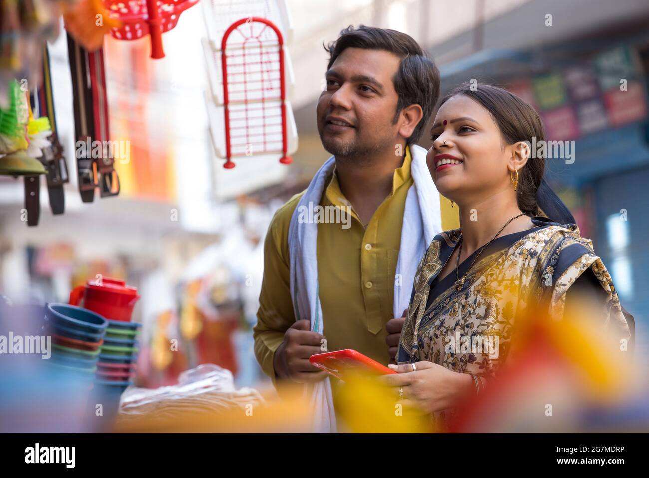 CLOSE SHOT OF A RURAL HUSBAND AND WIFE SHOPPING HOUSEHOLD ITEMS Stock Photo