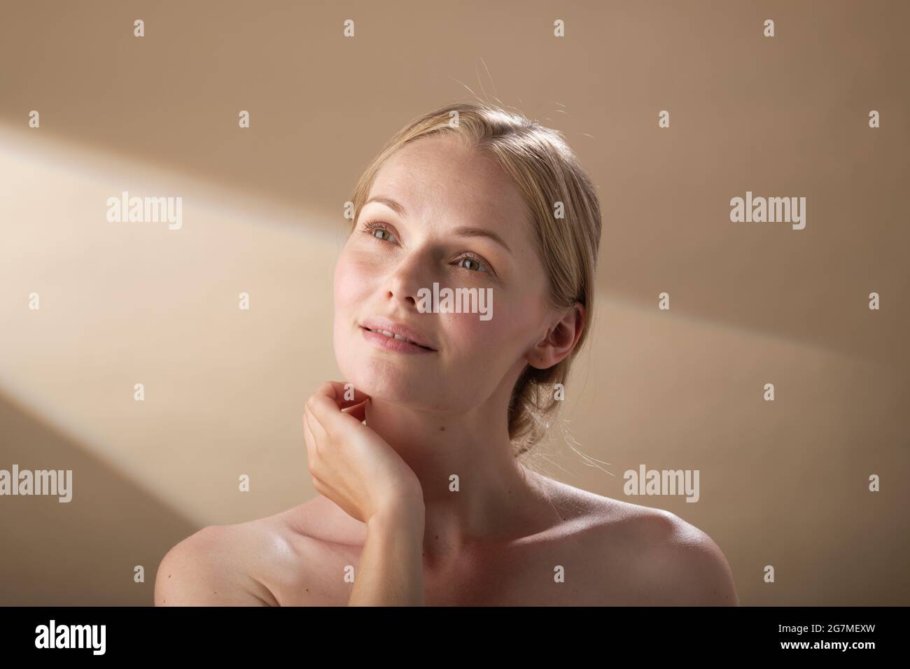 Beauty treatment regime. Contented woman. Distant thoughts. Stock Photo