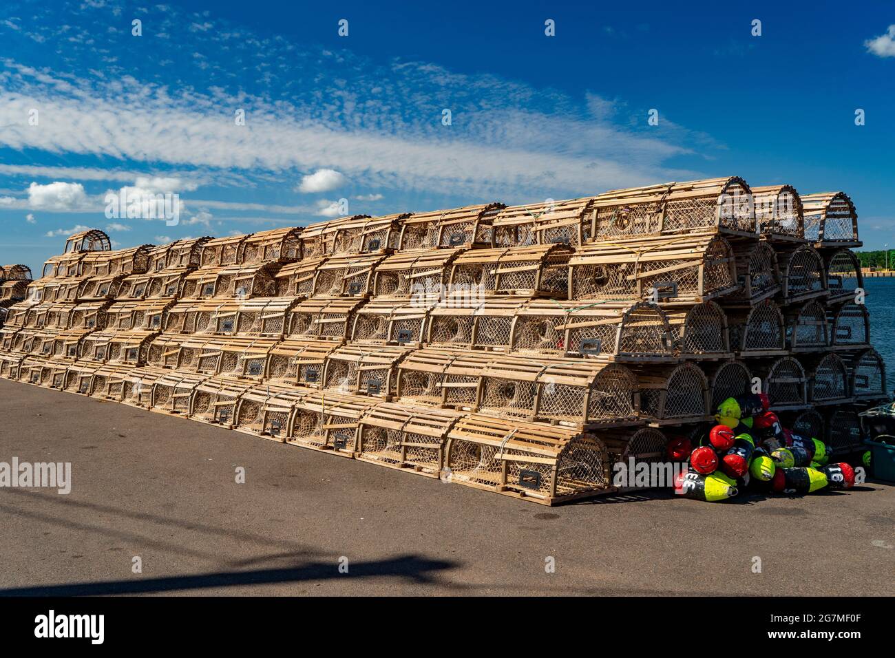 Lobster traps piled on a wharf in rural Prince Edward Island, Canada. Stock Photo
