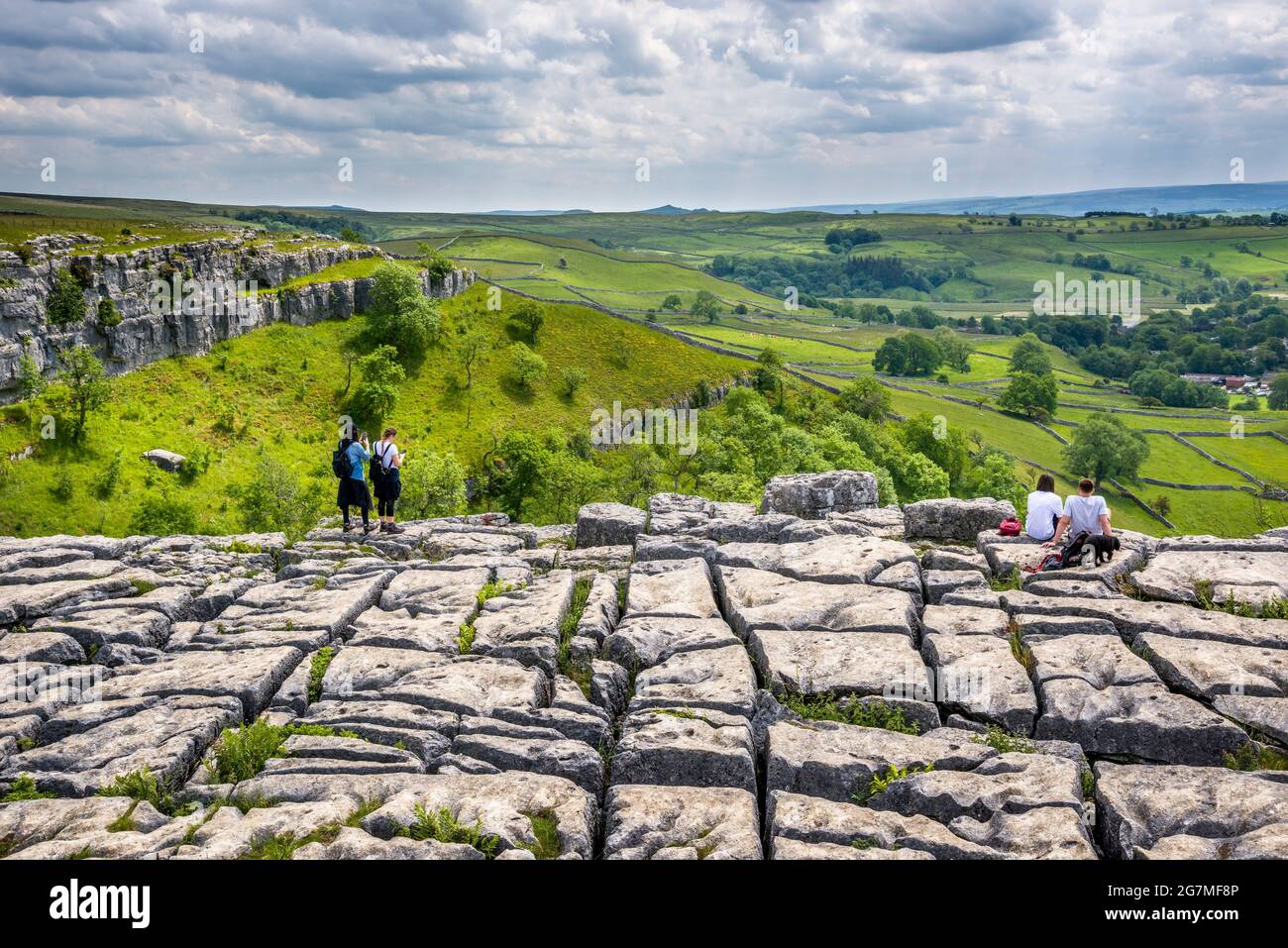 Malham Cove near the village of Malham, Wharfedale, Yorkshire Dales National Park, England, UK on a sunny summer's afternoon Stock Photo