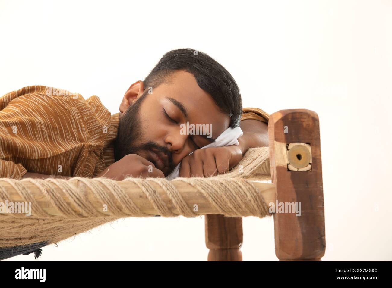 CLOSE SHOT OF A RURAL MAN SLEEPING ON A COIR COT Stock Photo Alamy