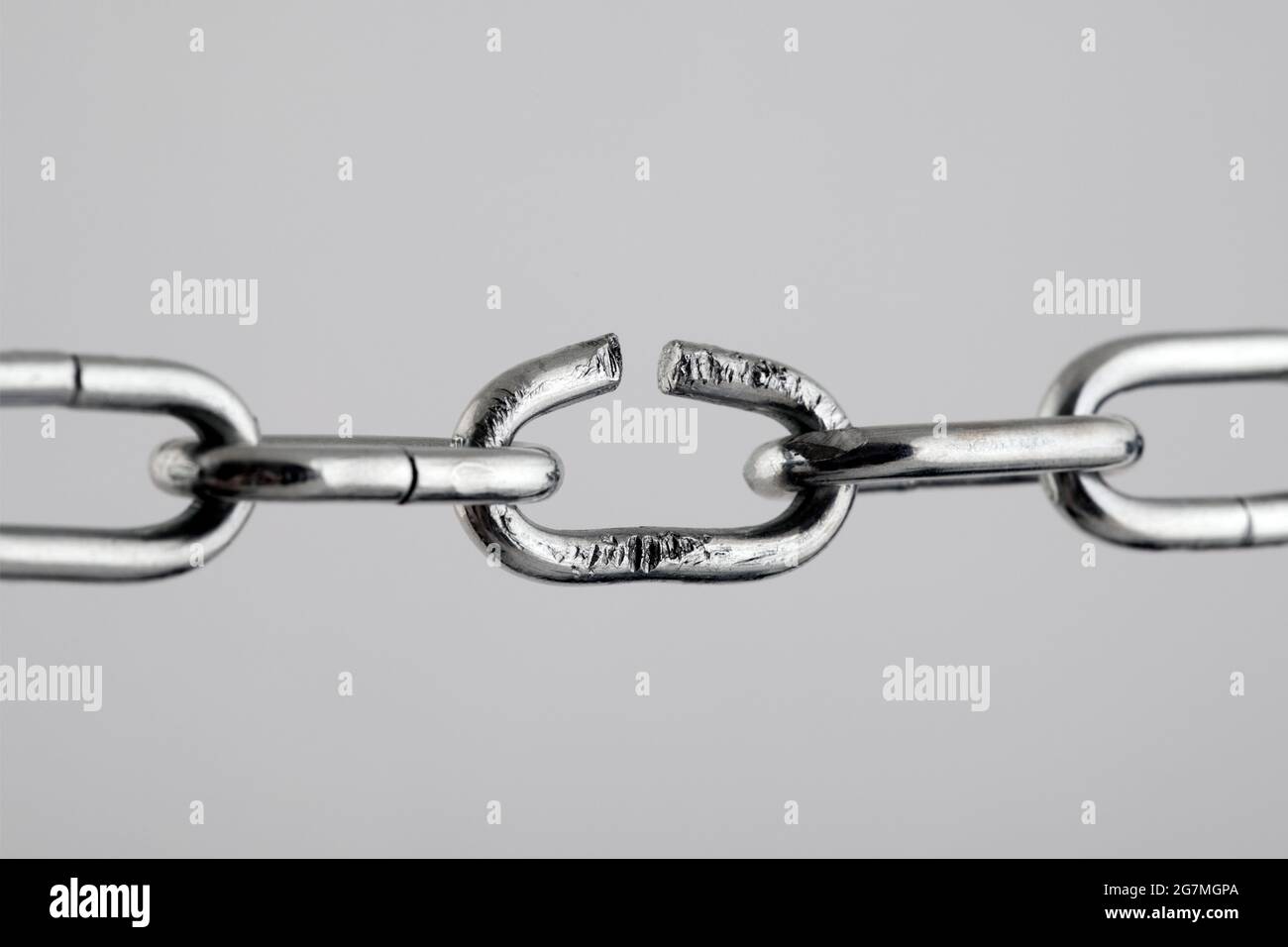 Broken silver metal chain, concept of freedom Stock Photo Alamy