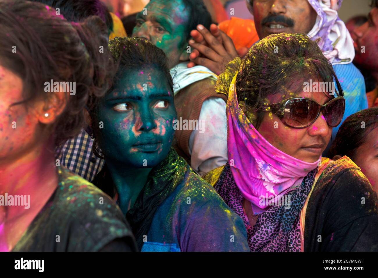 Revellers gather at the Shriji Temple (Laadli Sarkar Mahal),in Barsana, during Lathmar Holi, smeared with coloured powder. It is held during a full mo Stock Photo