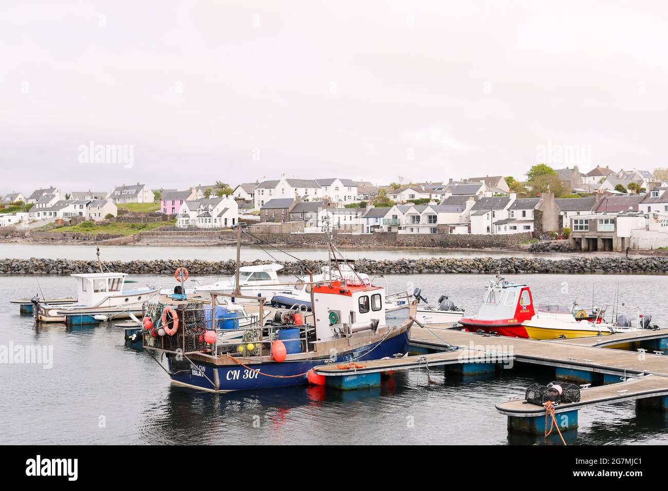 A fishing boat moored in Bowmore on the Isle of Islay off the west coast of Scotland.  The small island is famous for it many whisky distilleries. Stock Photo