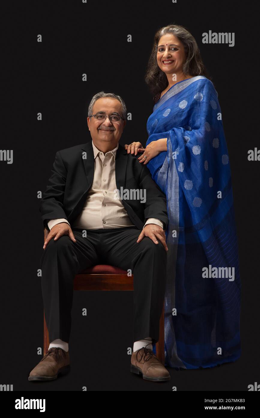 Smiling older couple sitting on bed - Stock Image - F005/3060 - Science  Photo Library