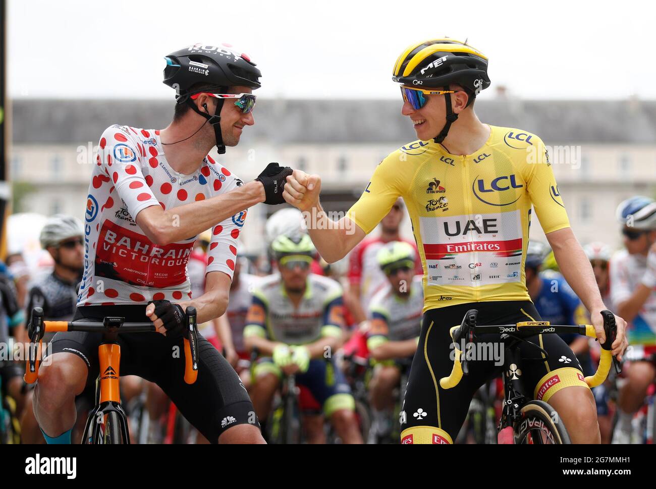 Cycling - Tour de France - Stage 18 - Pau to Luz Ardiden - France - July  15, 2021 UAE Team Emirates rider Tadej Pogacar of Slovenia bumps fists with  Bahrain Victorious