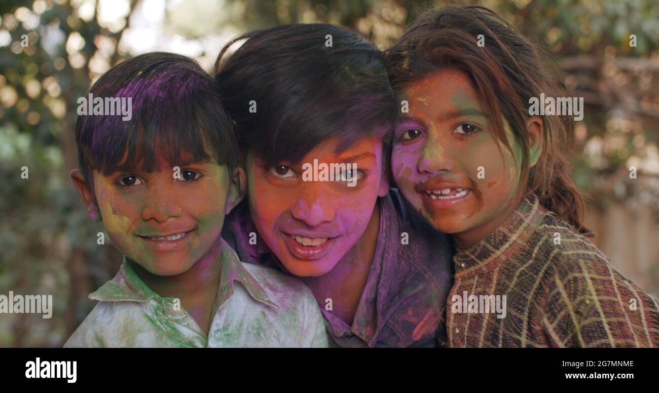 Indian kids with painted faces on Holi festival Stock Photo