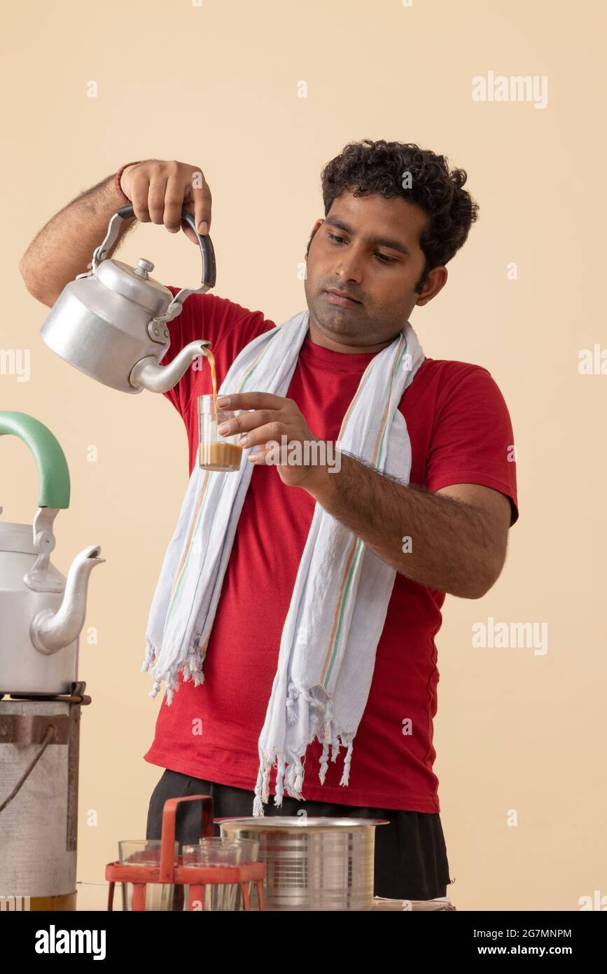 A TEA SELLER POURING TEA INTO A GLASS Stock Photo Alamy