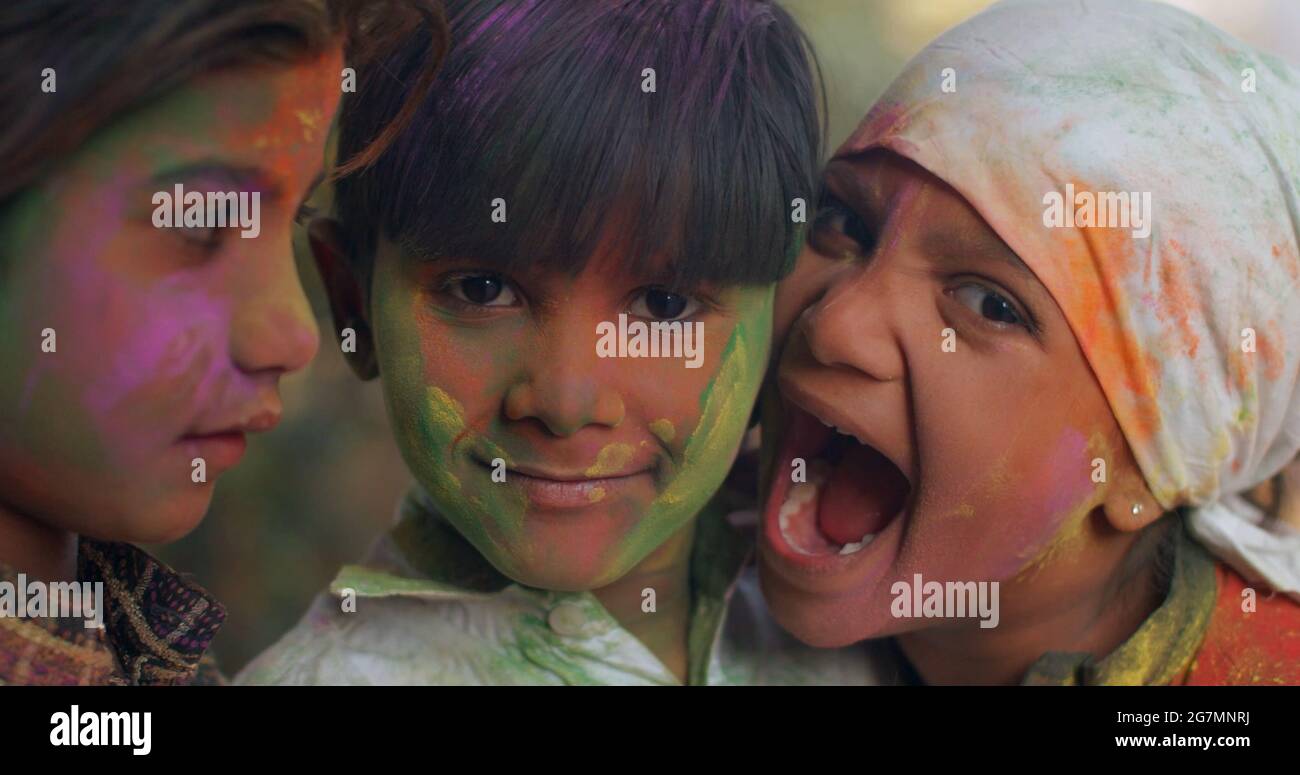 Indian kids with painted faces on Holi festival Stock Photo