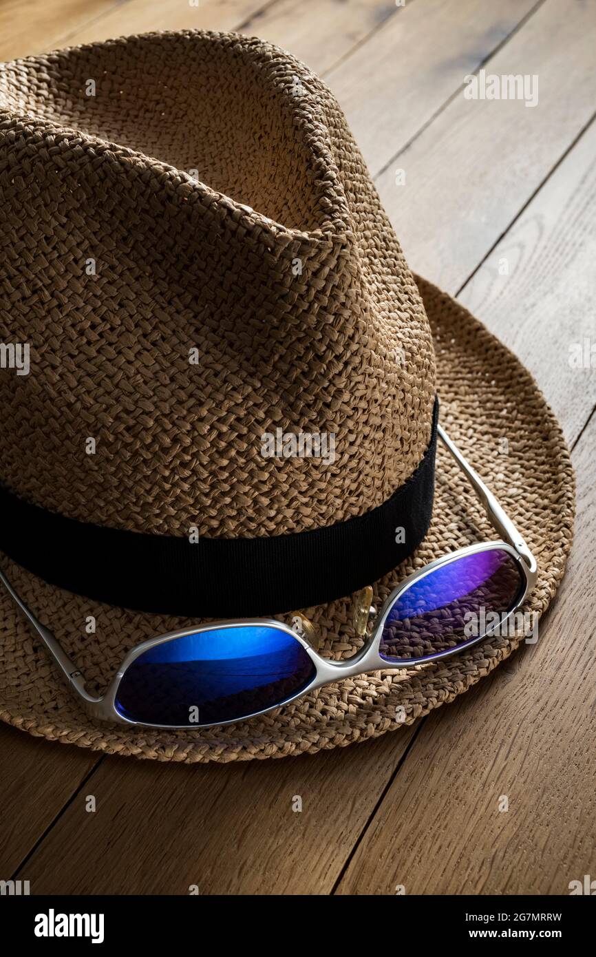Straw hat and sunglasses. Stock Photo