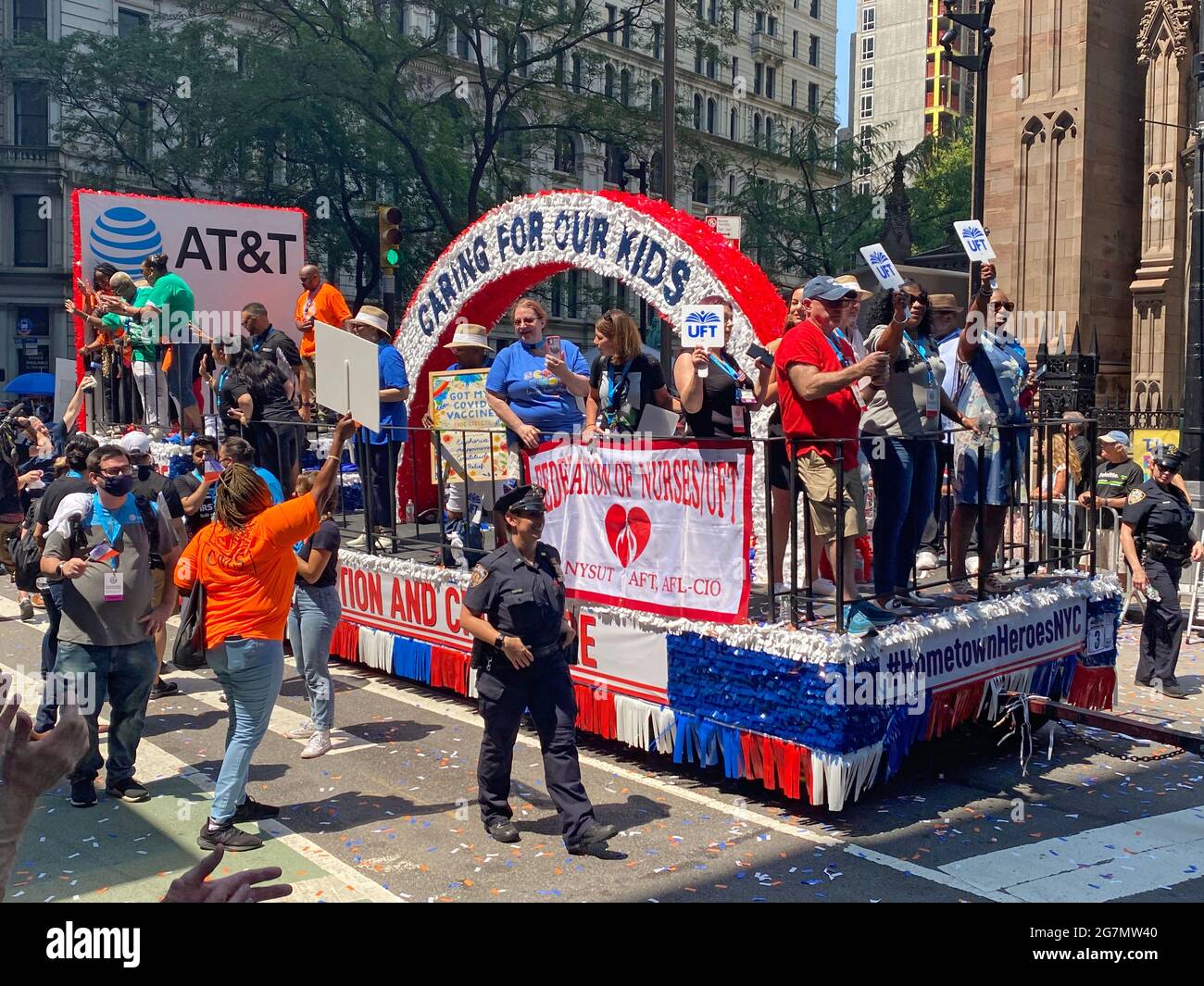 Essential workers who helped New York City through the COVID-19 pandemic were honored with a special parade up the Canyon of Heroes along Broadway in lower Manhattan. UFT (united Federation of Teachers)childcare workers had a float in the parade. Stock Photo