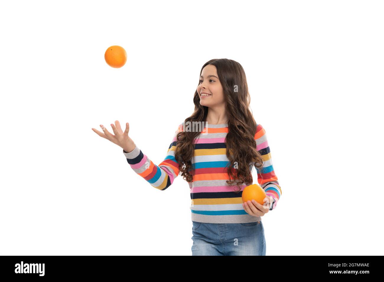 juggle. childhood health. citrus fruits. natural organic fresh orange. healthy life. Stock Photo