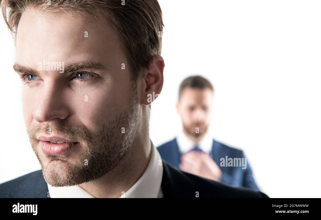 Good-looking person. Serious face of young businessman. Professional man with unshaven face Stock Photo