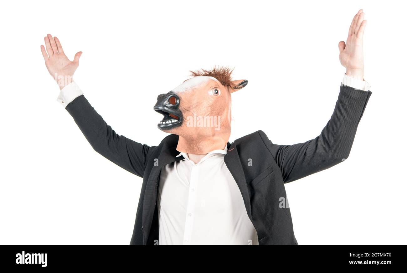 Hardworking man businessman wear weird horse head mask in formalwear isolated on white, workhorse Stock Photo