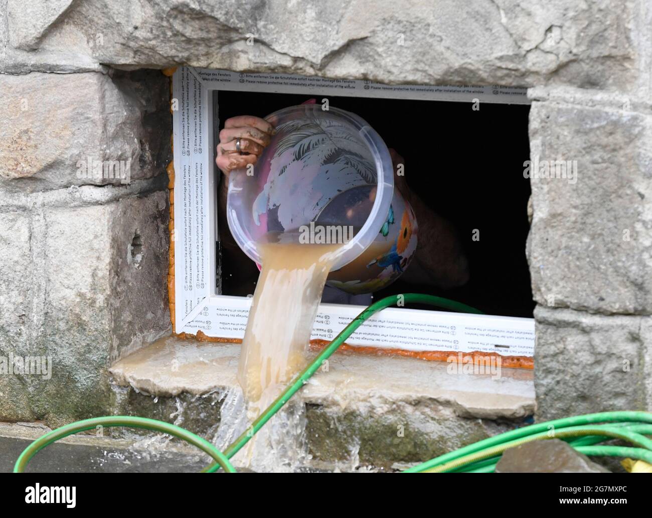 Hagen Germany 15th July 21 A Resident Removes His Damages In The Cellar In Which He Carries Without Further Ado The Water With A Bucket From The Cellar Which Has Brought The