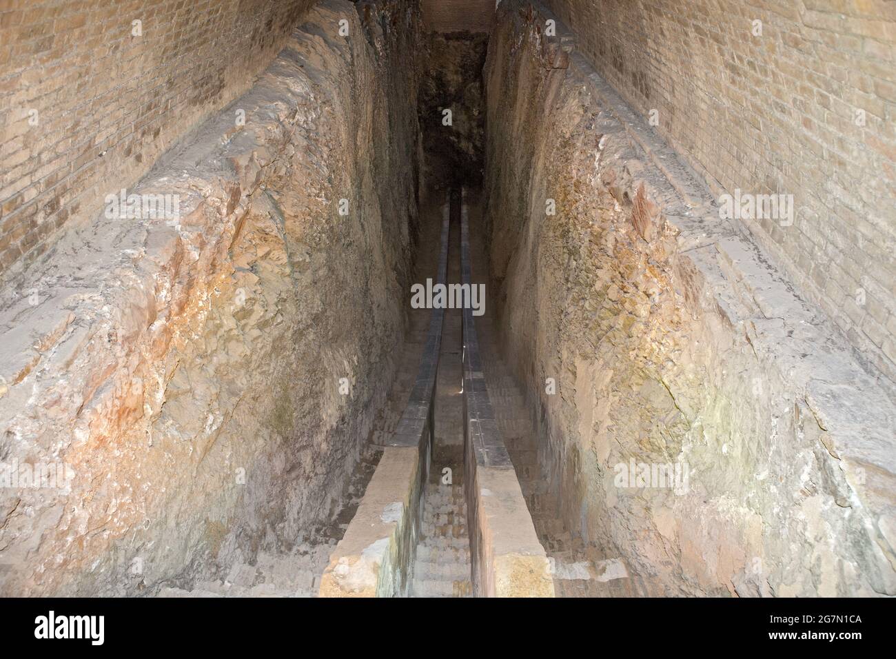 Part of the original giant goniometer, vertical circle to mark sun's position so calculate days of the year: Ulugh Beg's Obervatory, Samarkand, Uzbeki Stock Photo