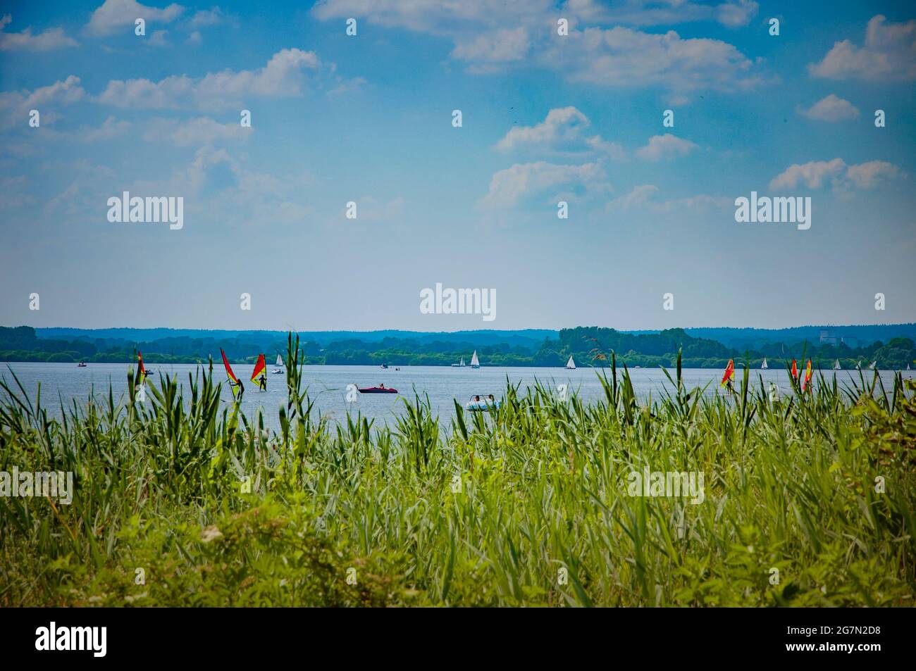 BOHMTE, GERMANY. JUNE 27, 2021 Dammer Natural Park. Lake view, boats, yachts, pier people resting on the beach Stock Photo
