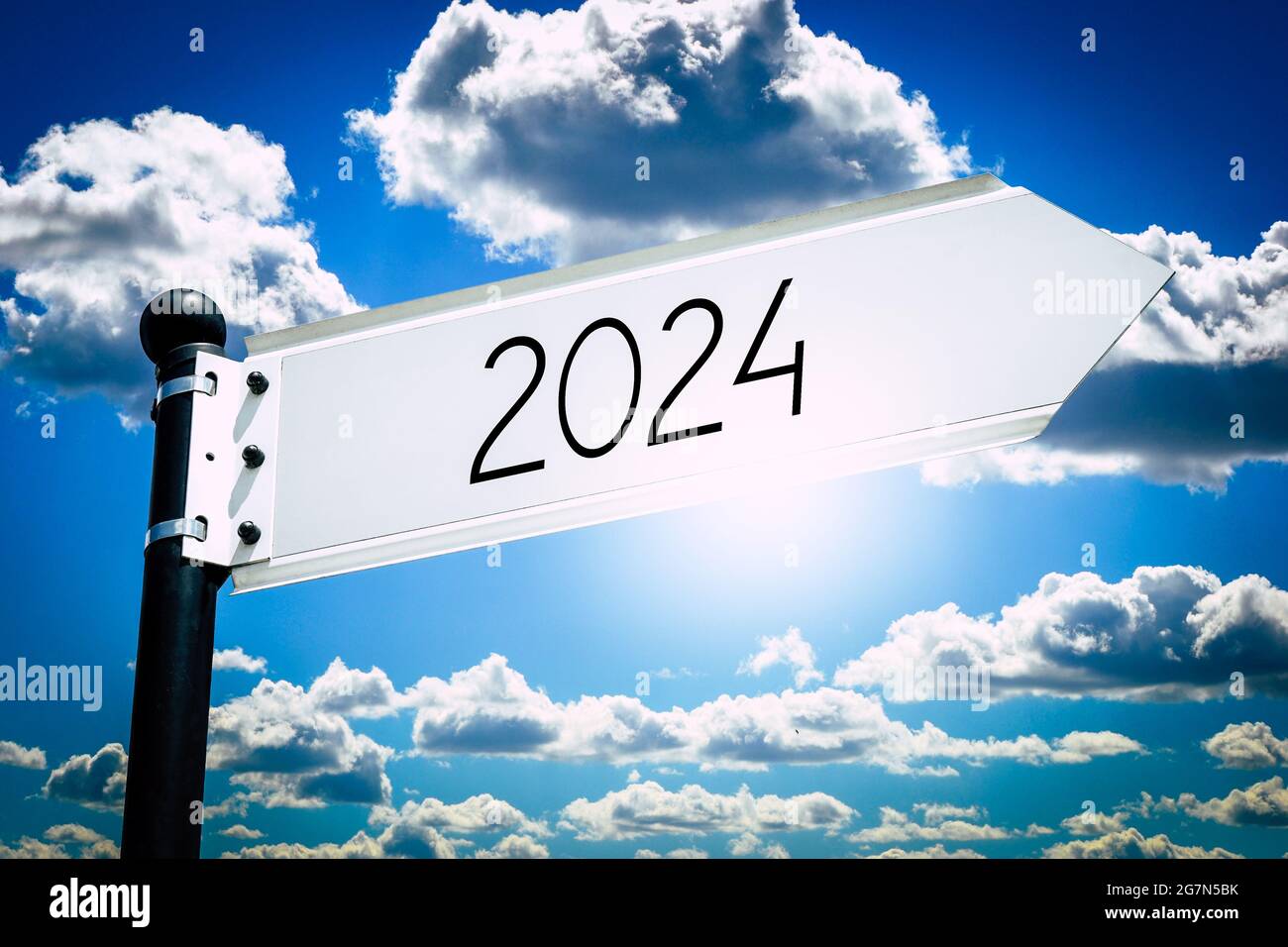 2024 signpost with one arrow, sky in background Stock Photo Alamy