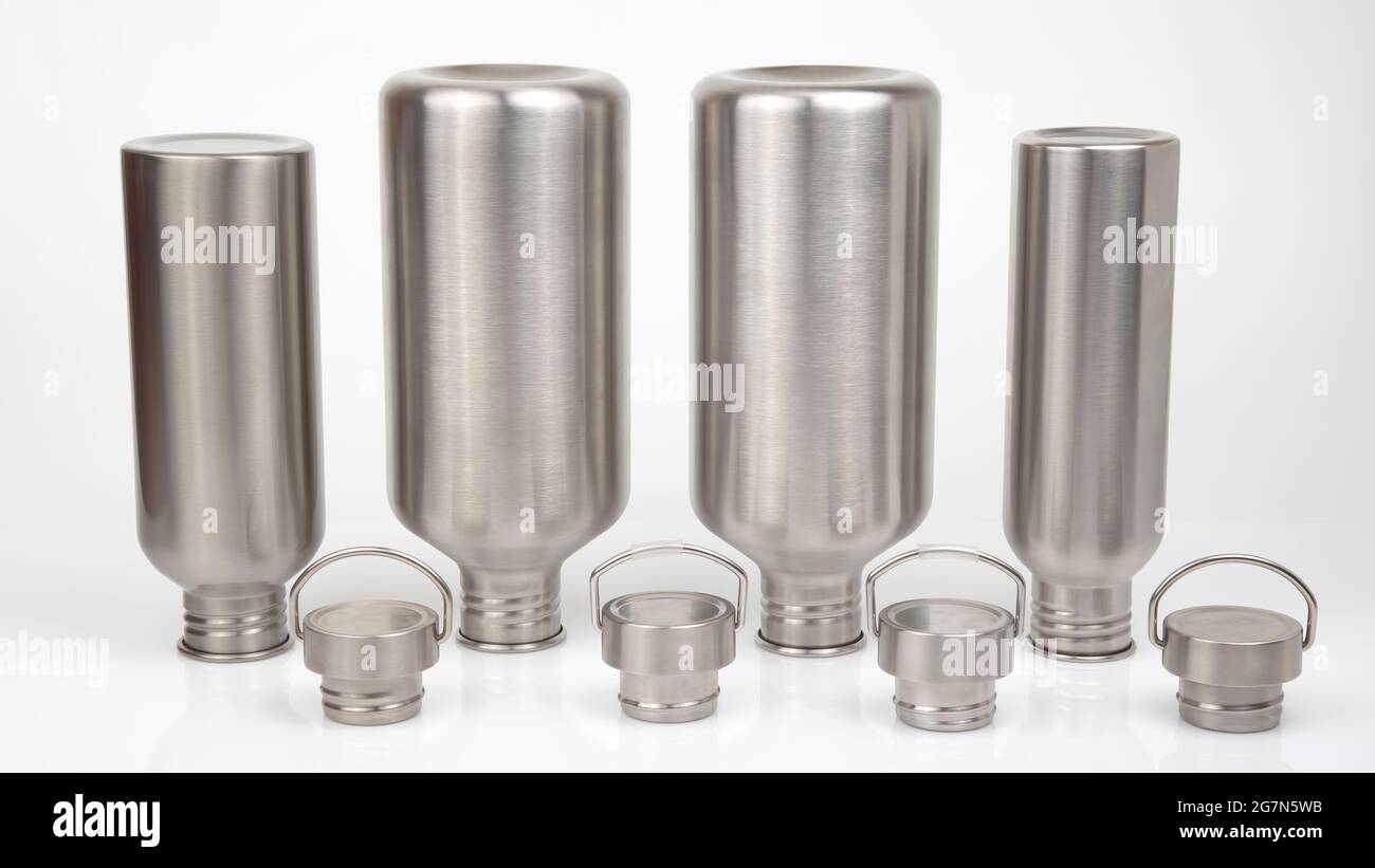 Steel flasks for water and drinks on a white background. Survival