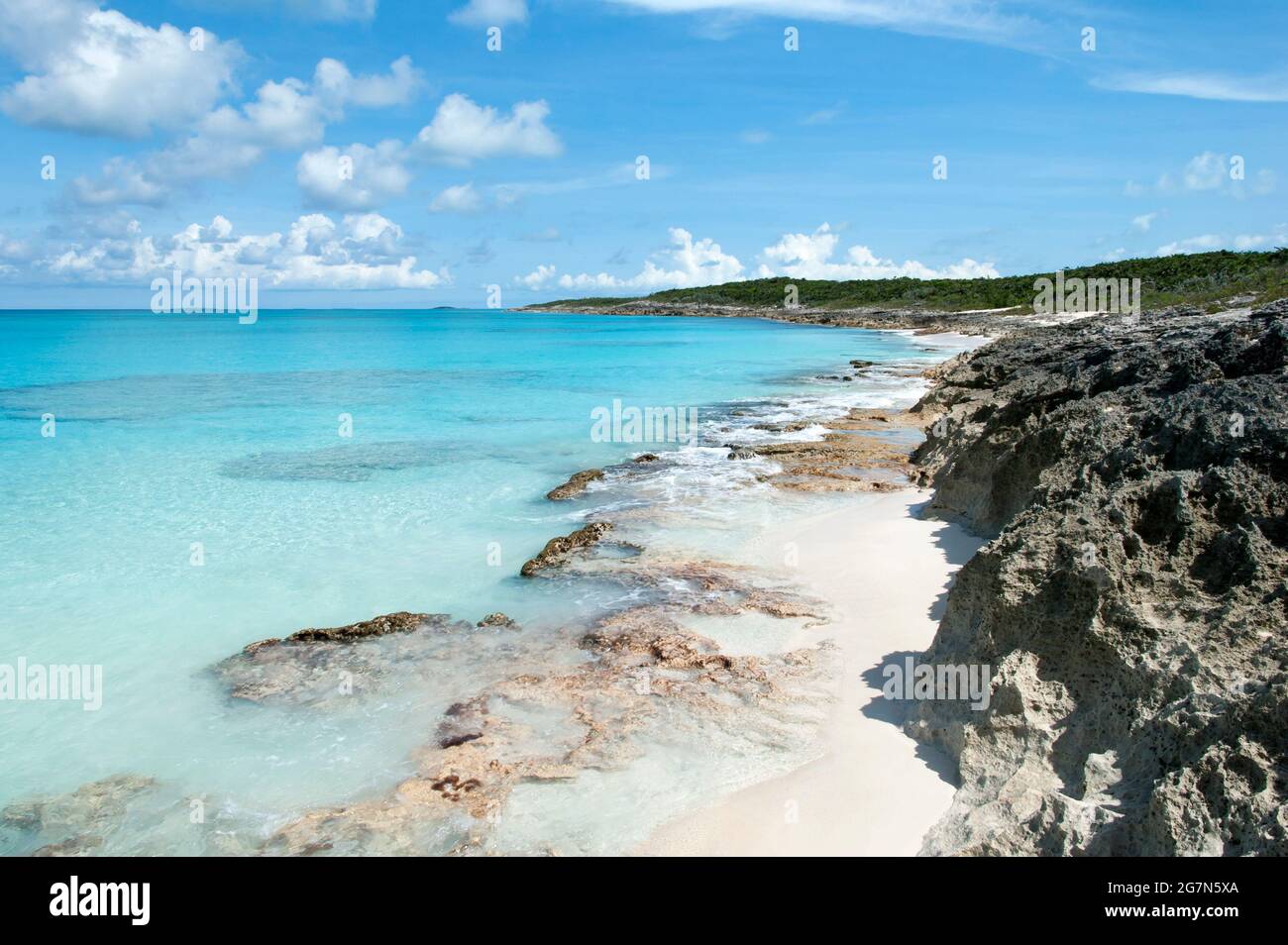 The scenic view of Half Moon Cay rocky beach and crystal clear ...